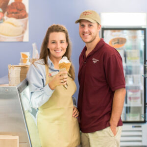 kilwins workers holding an ice cream cone