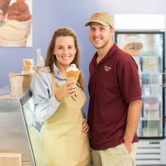 kilwins workers holding an ice cream cone